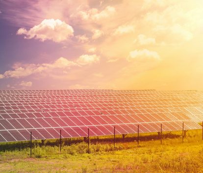 Alternative and renewable energy concept, sun shining on solar panels Alternative and renewable energy concept, sun shining on solar panels