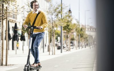 Young man riding e-scooter in the city Young man riding e-scooter in the city